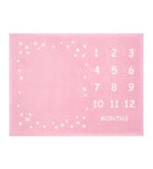 Pink milestone blanket with white numbers and stars