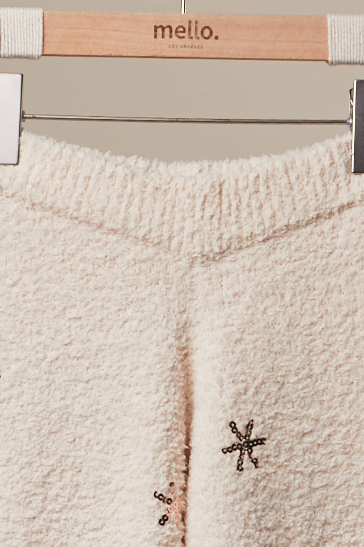 Close-up of the plush fuzzy knit waistband of the ivory Christmas Tree Sweater Pants