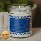 Candle in a glass jar with a blue label reading 'Coastal Lemon' from Sweet Water Decor, on a neutral background.