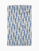 dish towel with a repeating blue fish pattern, laid flat against a clean white background.