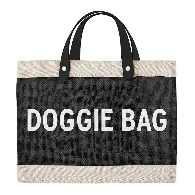 Black tote bag with 'DOGGIE BAG' text on a white background