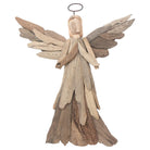 Wooden angel figurine with driftwood wings on a white background