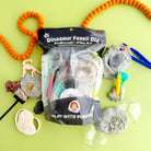 Earth Grown KidDoughs Dino Fossil Dig KidDough Play Kit contents with cookies and cream scented dough and fossil dig accessories