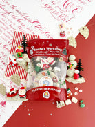 Earth Grown KidDoughs Santa's Workshop KidDough Play Kit flat lay with sprinkles, trees and holiday tools