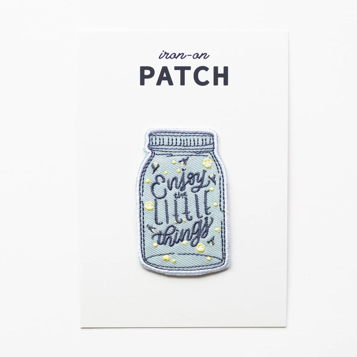 Iron-on patch with a mason jar design and 'Enjoy the little things' text on a white background.