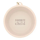 Round beige plate with 'Favorite child' text on a white background