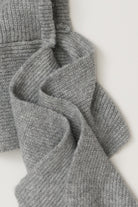 Close-up of the ribbed knit and long scarf ties on the Free People Extra Large Balabonnet in grey