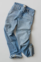 Flat lay of the Fable Low-Rise Twisted Seam Jean in Art School light wash denim