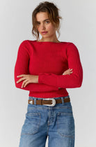 Model wearing the Free People Mila Pullover in salsa red, a cropped ribbed boatneck sweater, front view