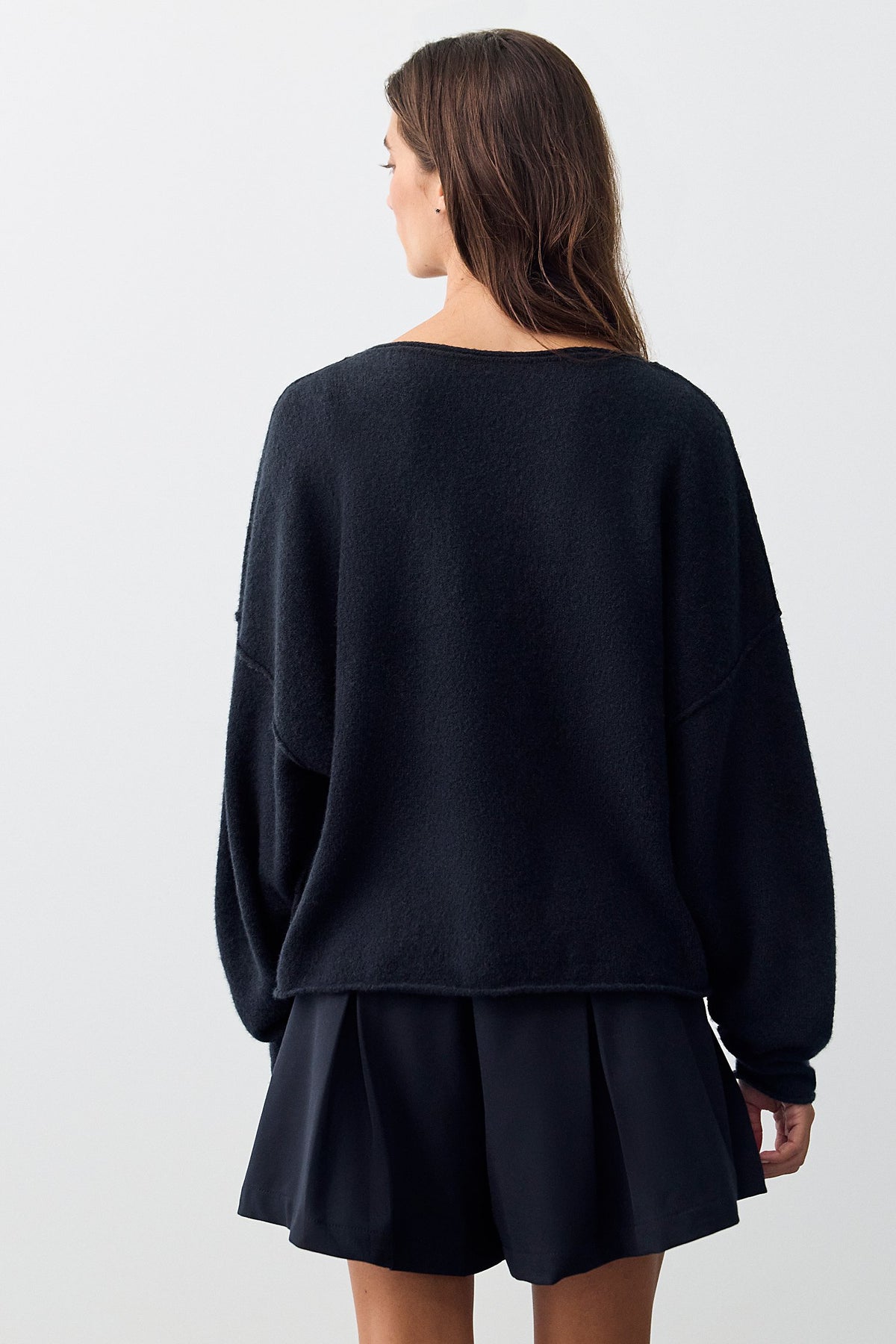 Back view of the black See Me V-Neck Pullover showing the slouchy fit