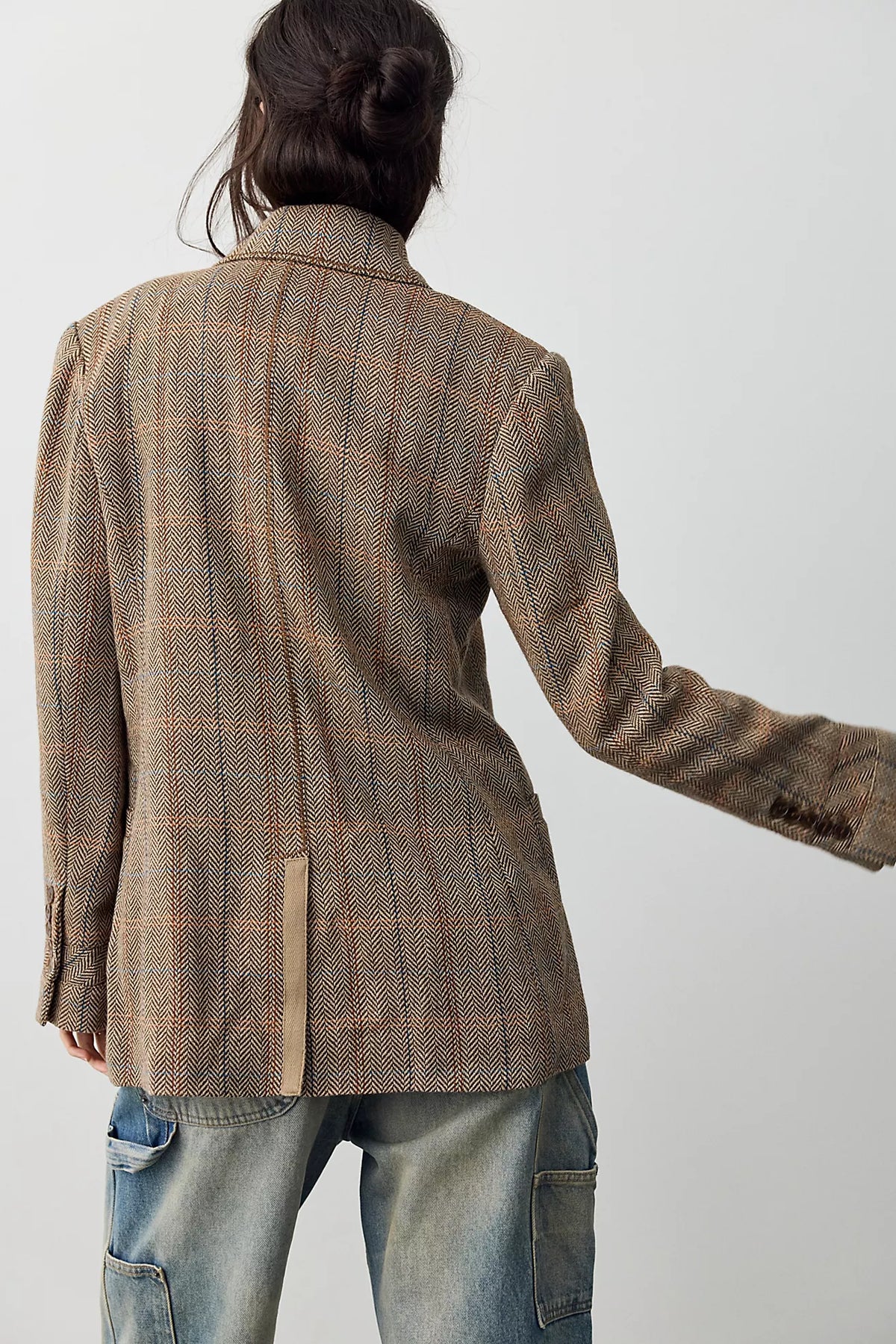 Back view of the Free People Shiloh Blazer, a relaxed brown and beige plaid wool-blend blazer with a center back vent