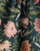 Close-up of the Geometry Chrysanthemums In November tea towel coral and blush mums on forest green