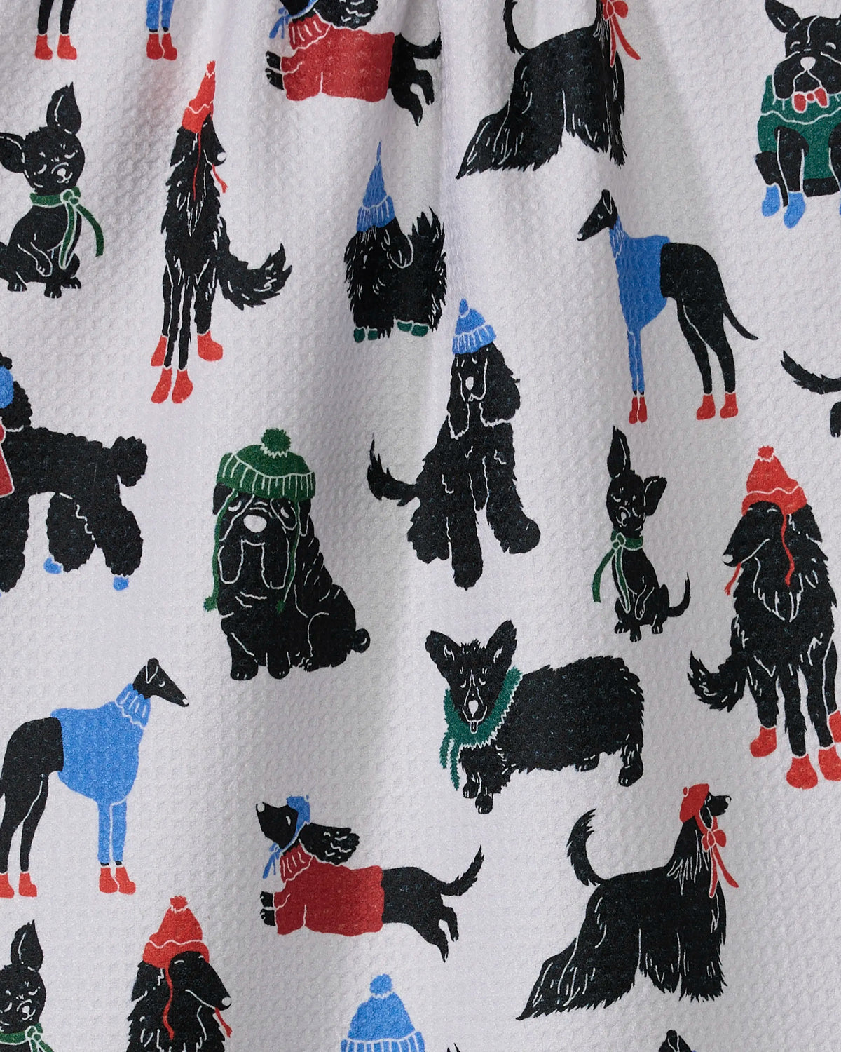 Close-up of the Geometry Dogue Magazine tea towel print of stylish dogs in colorful coats