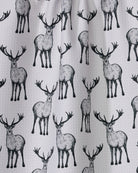 Close-up of the Geometry Hartley tea towel black stag print on white