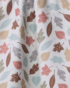 Close-up of the Geometry Harvest Scatter tea towel autumn leaf print in sage, teal, rust and mauve