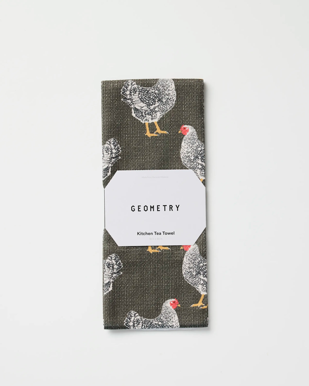 Geometry Hen House tea towel folded in its gift-ready Geometry packaging