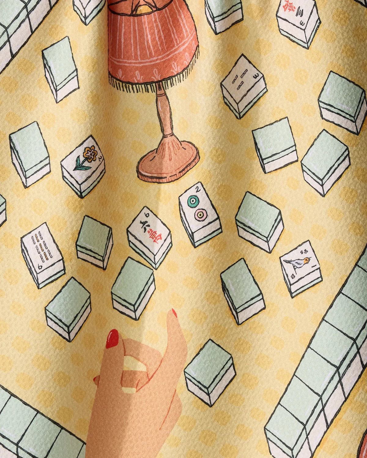 Geometry Lucky Hand mahjong tea towel styled at a mahjong table