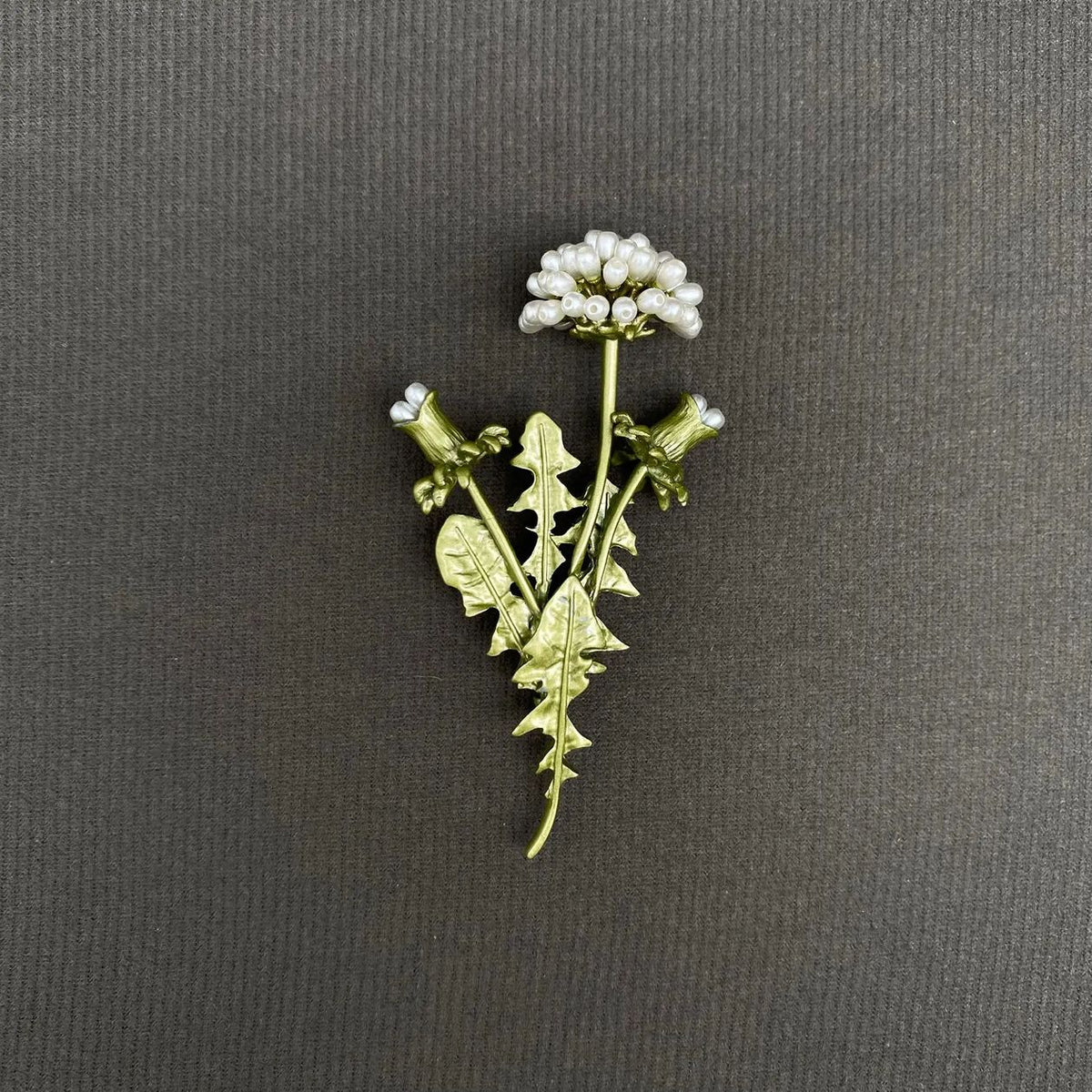 Gold-tone dandelion brooch with clear rhinestones