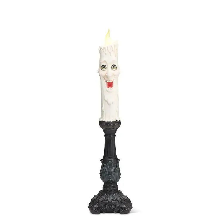 Happy Candle Halloween LED candlestick with smiling wax-drip candle on an ornate black base
