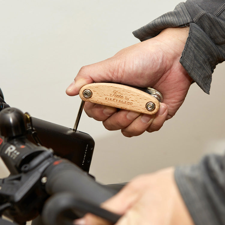 Adjusting a bicycle with the Kikkerland 16 in 1 bike tool