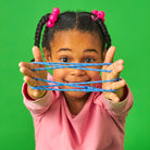Child playing the Kikkerland cat's cradle string game
