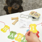 Dog celebrating with the Kikkerland dog birthday kit