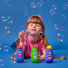 Child blowing bubbles with Kikkerland Kidoki monster bubbles
