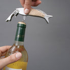 Opening a bottle of white wine with the Kikkerland fish corkscrew