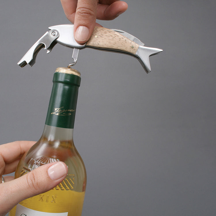 Opening a bottle of white wine with the Kikkerland fish corkscrew