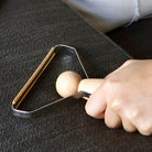 Removing lint from a sweater with Kikkerland Mr. Lint