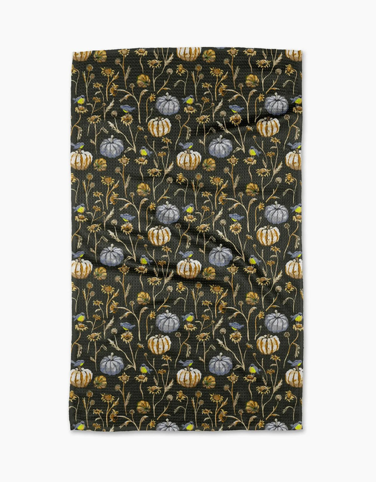 Last Seeds tea towel in deep charcoal with gray-blue and gold pumpkins, dried flowers, and small songbirds