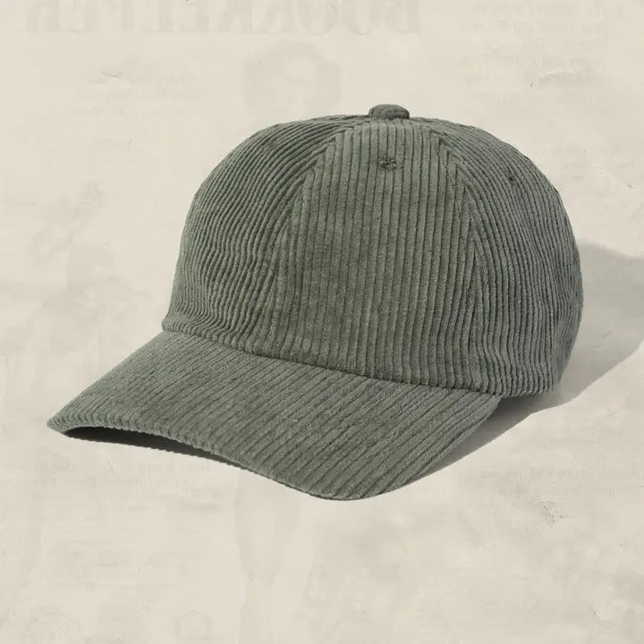 green baseball cap with perforated design on a white background