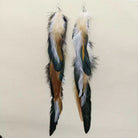 Pair of long feather dangle earrings in natural multi-tone colors