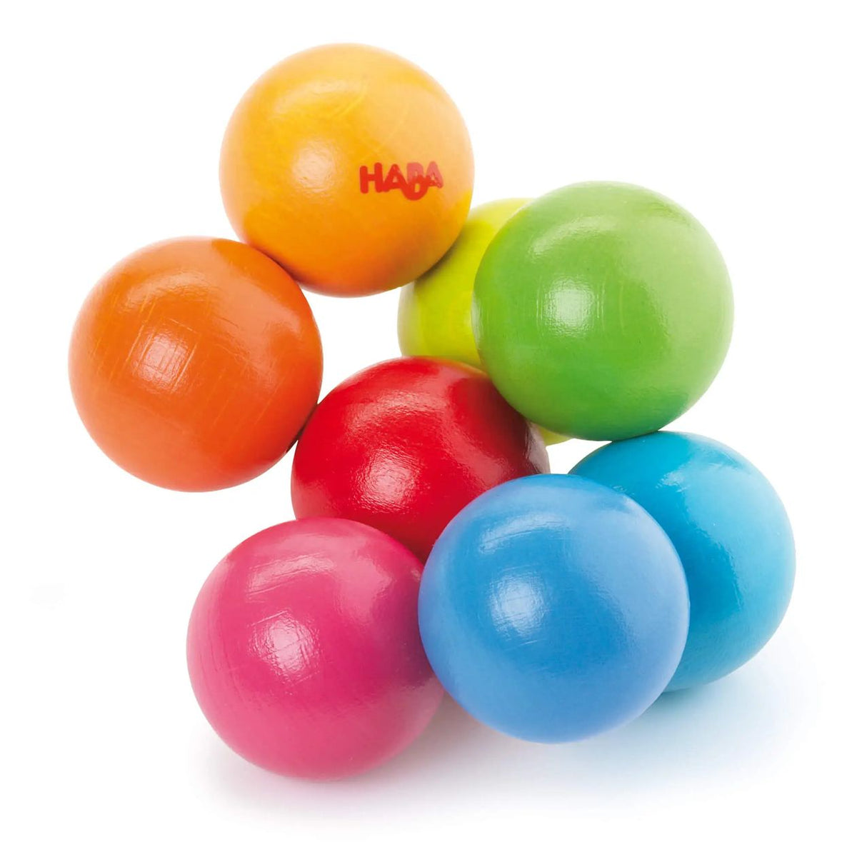 Colorful plastic balls with HABA logo on a white background