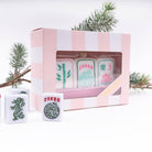 Mahjong tile Christmas ornament in its pink striped gift box with real mahjong tiles and evergreen