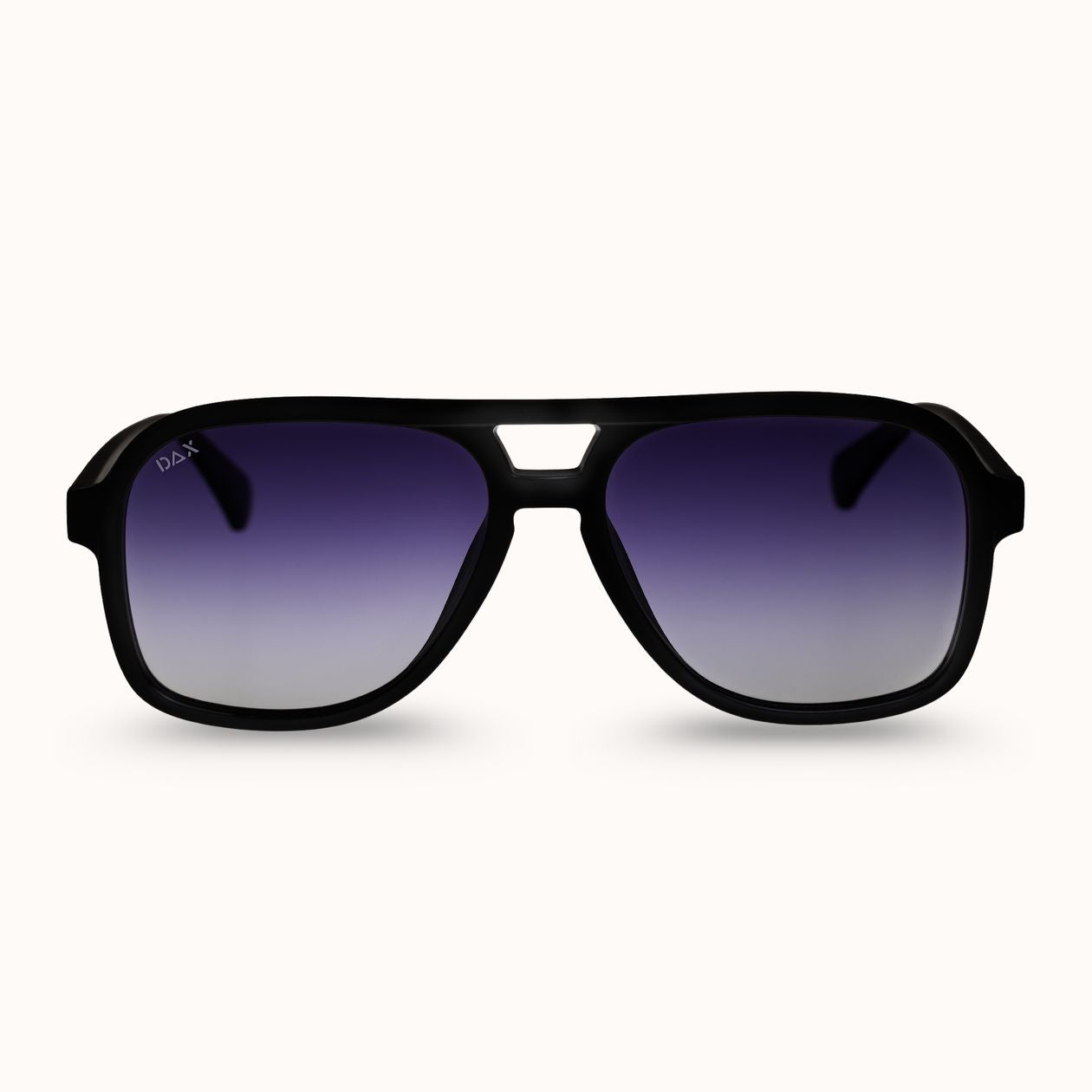 A pair of matte black aviator-style sunglasses with a gradient purple-to-silver lens, shown against a plain off-white background.