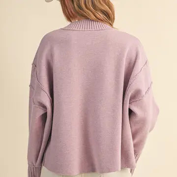 Back view of the &merci Mock Neck Ribbed Sweater in lavender with drop shoulders and ribbed hem