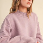 Close-up of the &merci Mock Neck Ribbed Sweater in lavender showing the ribbed mock neck and drop shoulder seam
