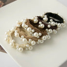 ADORRO textured hair ties with pearl detail in neutral tones