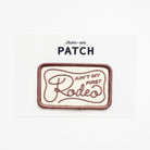 Iron-on patch with text 'Ain't my first rodeo' on a white background