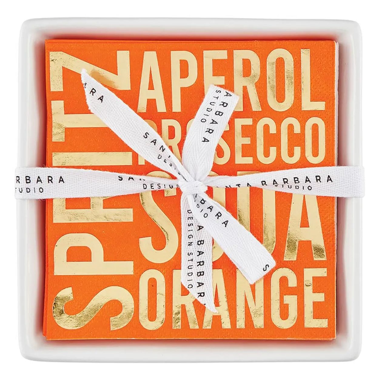 An orange square gift box containing a matching orange square item, tied with a white ribbon printed with 'BARBARA STUDIO'. The front features large gold foil text reading 'SPIRIT NAPEROL SECCO ORANGE'.