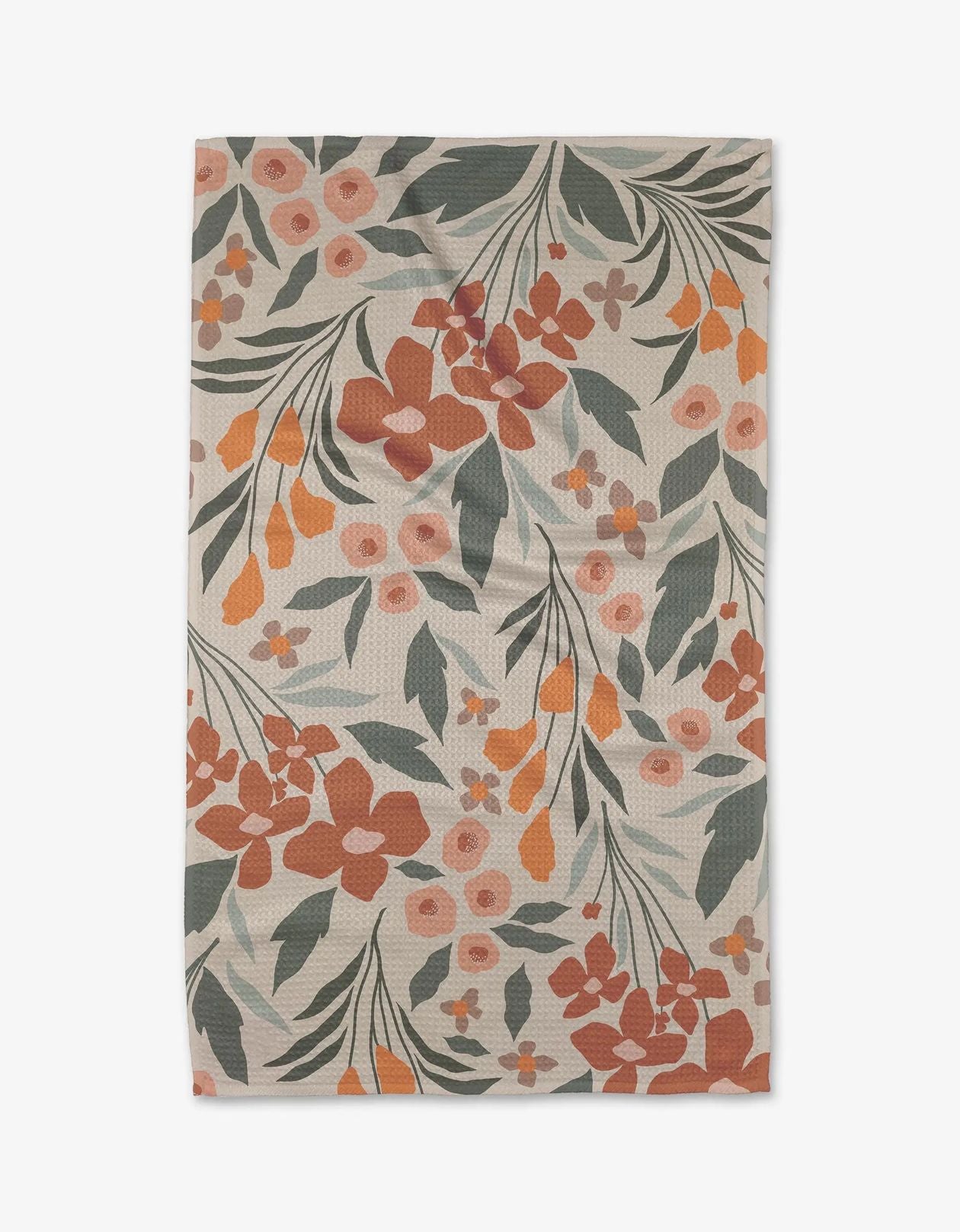 Floral patterned rug with orange, green, and pink flowers on a beige background
