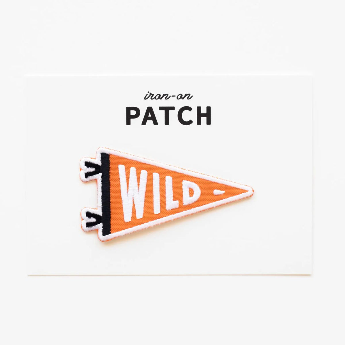 Triangle-shaped iron-on patch with 'WILD' text on a white background