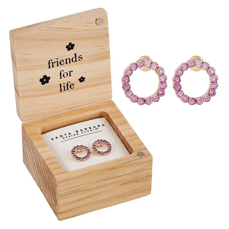 Pink hoop earrings in a wooden box with 'friends for life' text