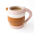 Back view of the pink reindeer coffee mug showing the brown body, white hat brim, and pink handle