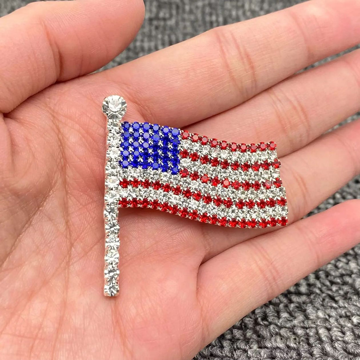 Red, white, and blue rhinestone American flag brooch