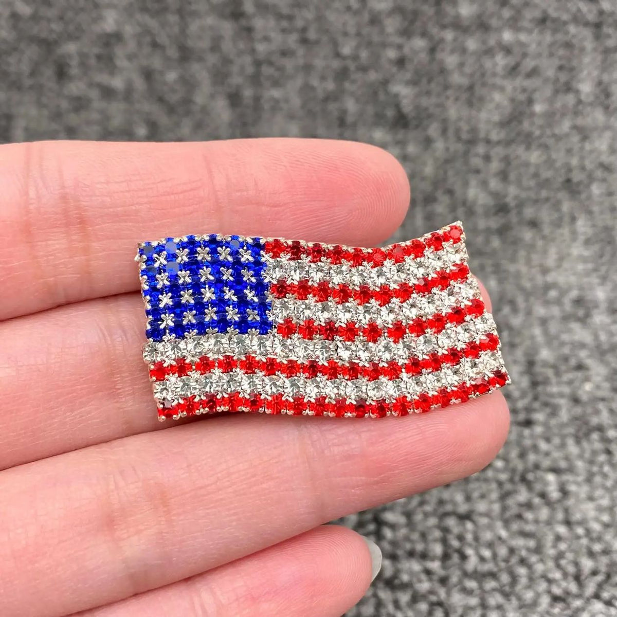 Red, white, and blue rhinestone American flag brooch