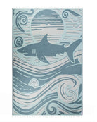 Shark-themed towel with wave patterns on a white background