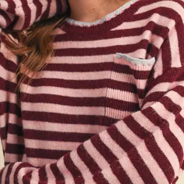 Close-up of the &merci Striped Pocket Sweater showing the fuzzy wine and pink knit and chest pocket with contrast triangle stitch