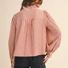 Back view of the &merci Striped Ruffle Blouse in red and cream stripes with long puff sleeves